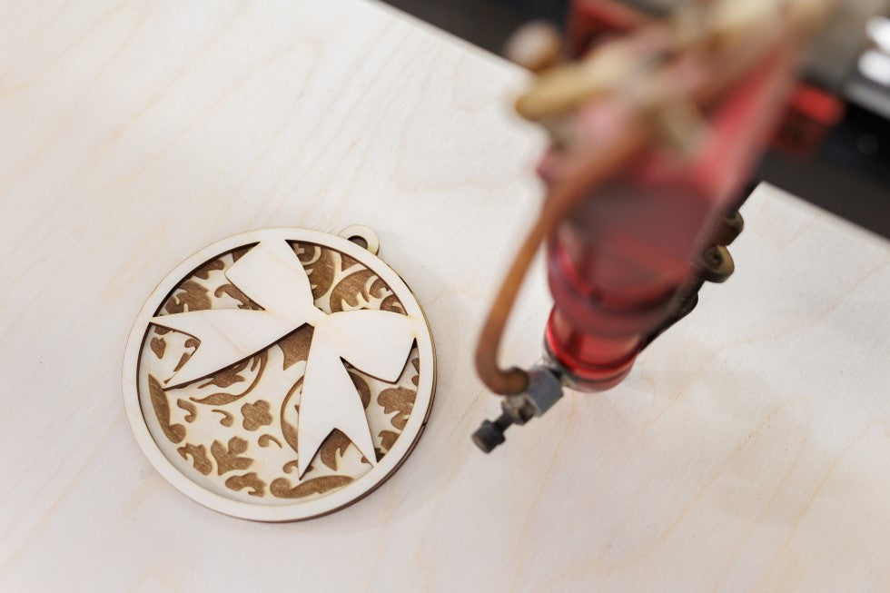 a wooden board using the OMTech laser engraving machine