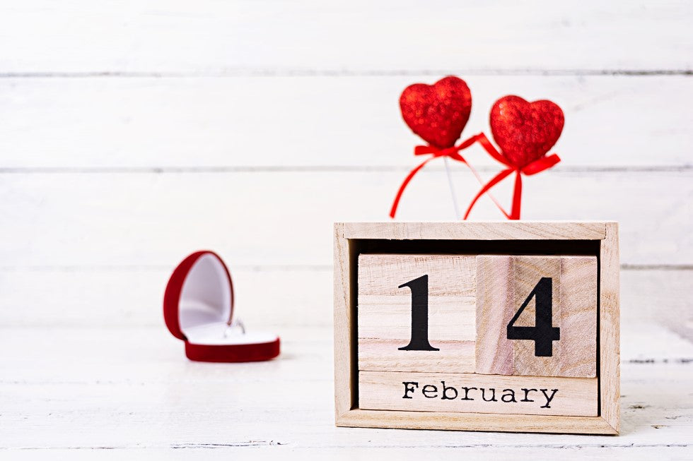 engrave the names and anniversary date of a couple on a wooden photo frame