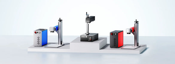 “OMTech fiber laser marking machines shown in a lineup, illustrating MOPA and non-MOPA models in a clean studio setup.”
