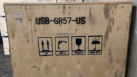 Wooden shipping crate labeled “USB-GR57-US” with handling symbols: this side up, no flip, fragile, and keep dry.