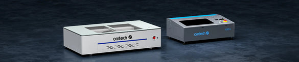 “Side-by-side comparison banner showing OMTech Polar Lite and OMTech K40+ desktop CO2 laser engravers on a dark background.”