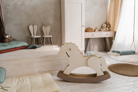 cardboard toy wheelchair horse in the interior 
