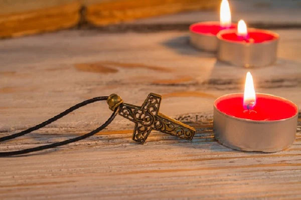 copper_cross_and_burning_candles