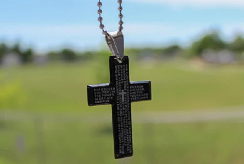 selective_focus_shot_of_a_cross_against_a_blurred